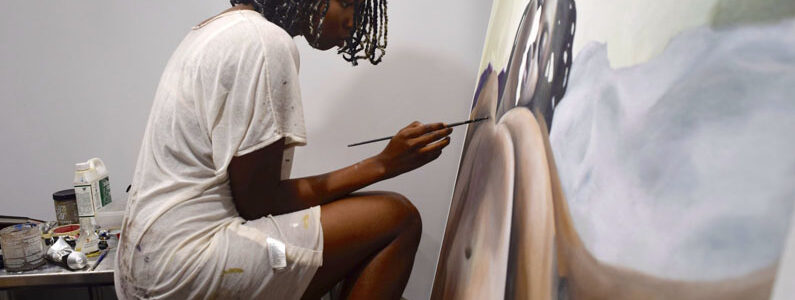 Portrait of an artist painting.