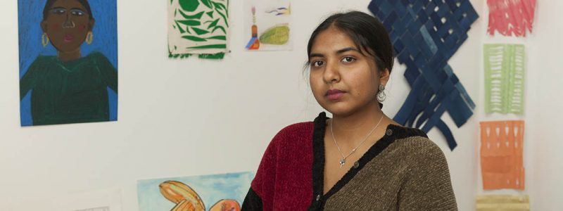 Portrait of the artist in their studio.