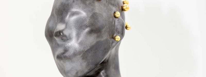 Installation shot of ceramic sculpture bust.