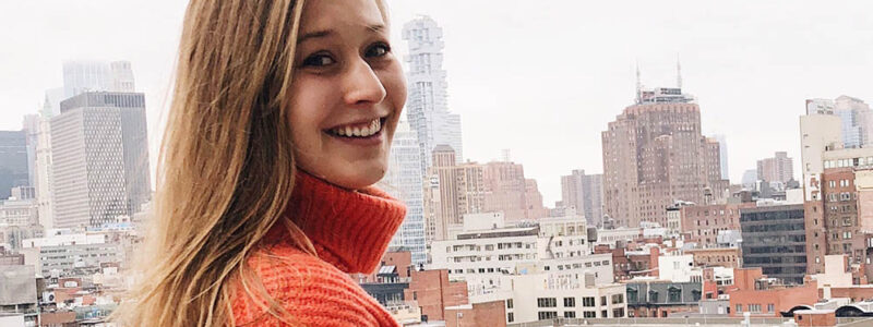 Photo of Allison Carey on a rooftop in NYC.