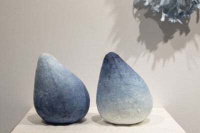 Blue and white conical objects made from paper.